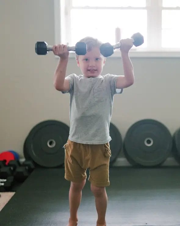 Kid lifting weights