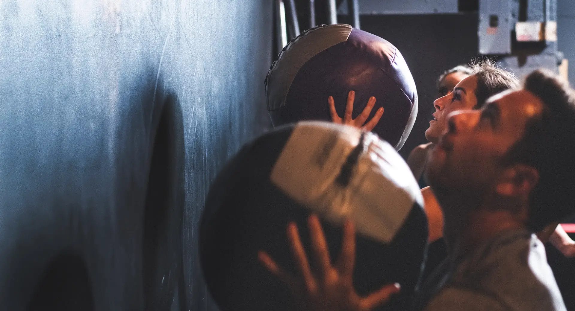 Members working out with ball