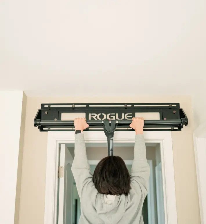 Woman doing pull up at home